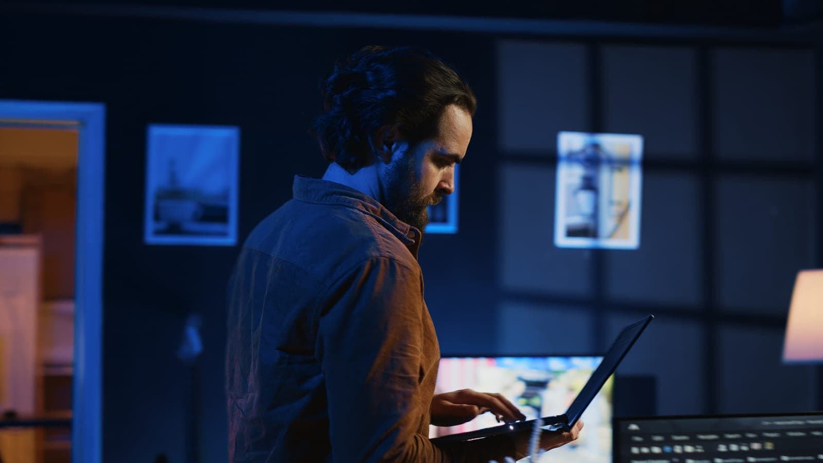 Designer reviewing ad creatives across multiple ad formats on screen.